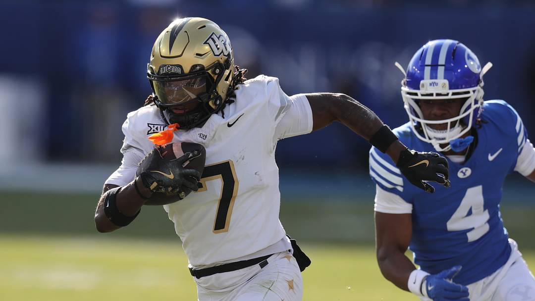 Nov 29, 2025; Provo, Utah, USA; UCF Knights wide receiver Duane Thomas Jr. (7) runs after a catch against BYU Cougars cornerback Mory Bamba (4) during the first quarter at LaVell Edwards Stadium. Mandatory Credit: Rob Gray-Imagn Images Nov 29, 2025; Provo, Utah, USA; UCF Knights wide receiver Duane Thomas Jr. (7) runs after a catch against BYU Cougars cornerback Mory Bamba (4) during the first quarter at LaVell Edwards Stadium. Mandatory Credit: Rob Gray-Imagn Images
