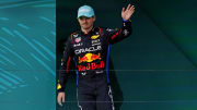 May 5, 2024; Miami Gardens, Florida, USA; Red Bull Racing driver Max Verstappen (1) celebrates on the podium after winning third place in the Miami Grand Prix at Miami International Autodrome. Mandatory Credit: Peter Casey-USA TODAY Sports