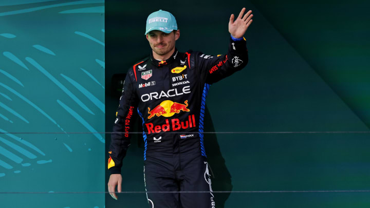 May 5, 2024; Miami Gardens, Florida, USA; Red Bull Racing driver Max Verstappen (1) celebrates on the podium after winning third place in the Miami Grand Prix at Miami International Autodrome. Mandatory Credit: Peter Casey-USA TODAY Sports