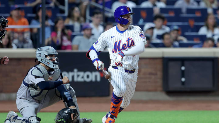Jun 25, 2024; New York City, New York, USA; New York Mets left fielder Brandon Nimmo (9) follows through on a ground ball that New York Yankees second baseman Gleyber Torres (not pictured) misplays for an error allowing a run to score during the sixth inning at Citi Field. Mandatory Credit: Brad Penner-USA TODAY Sports