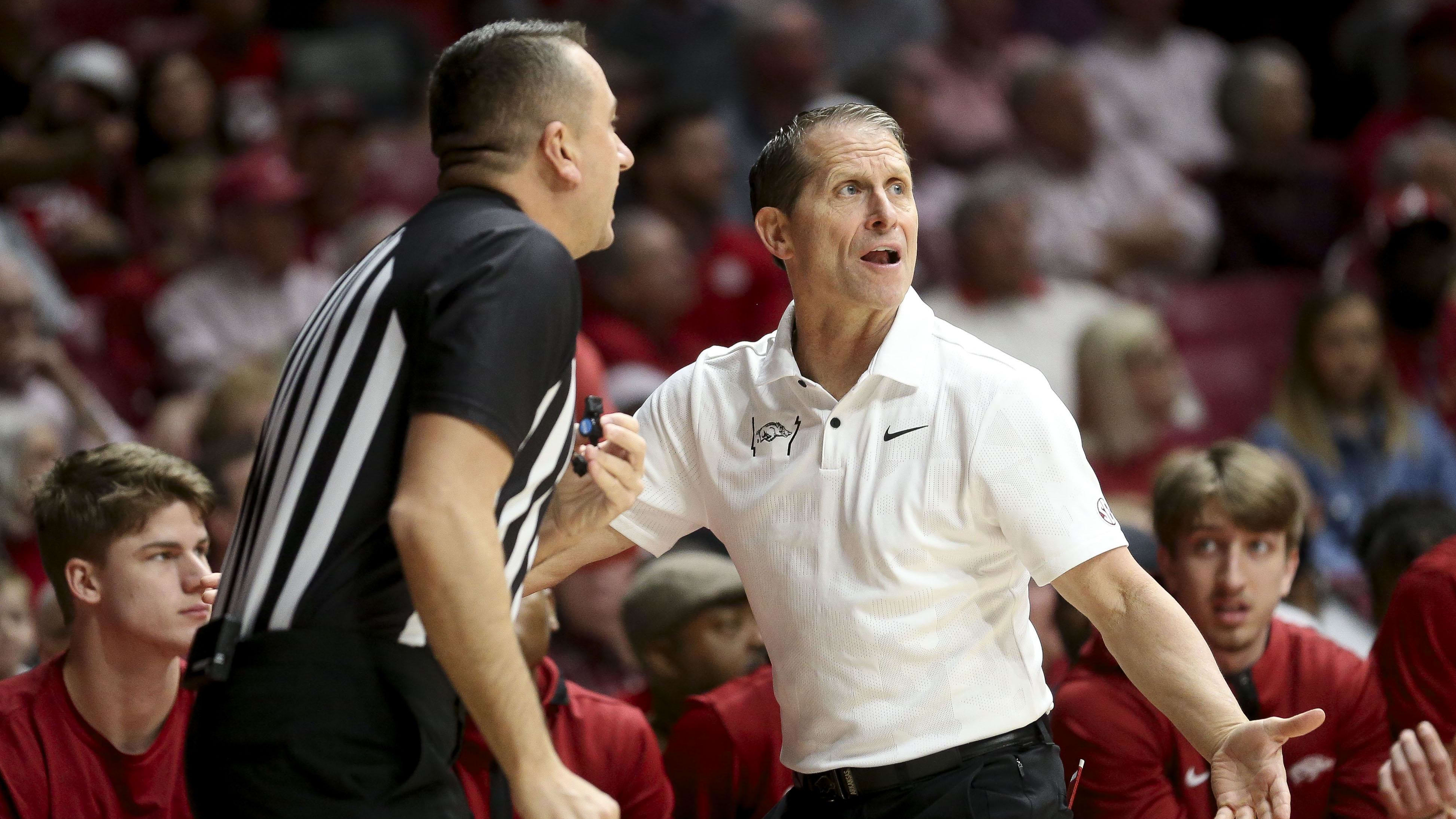 Arkansas coach Eric Musselman questions a referee about a call.