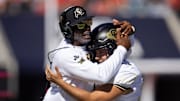 Oct 19, 2024; Tucson, Arizona, USA; Colorado Buffalos head coach Deion Sanders (left) embraces kicker Alejandro Mata against the Arizona Wildcats at Arizona Stadium. Mandatory Credit: Mark J. Rebilas-Imagn Images