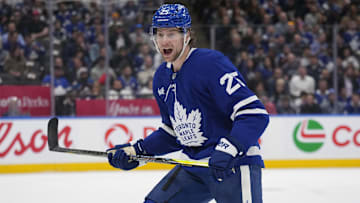 Mar 19, 2025; Toronto, Ontario, CAN; Toronto Maple Leafs defenceman Brandon Carlo (25) calls out a defence partner during the first period against the Colorado Avalanche at Scotiabank Arena. Mandatory Credit: John E. Sokolowski-Imagn Images