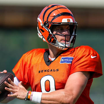 Cincinnati Bengals quarterback Joe Burrow (9) throws a pass during a preseason training camp practice in downtown Cincinnati on Wednesday, July 30, 2025.