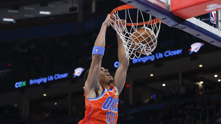 Dec 14, 2022; Oklahoma City, Oklahoma, USA; Oklahoma City Thunder forward Darius Bazley (55) dunks against the Miami Heat during the second half at Paycom Center. Miami won 110-108. Mandatory Credit: Alonzo Adams-USA TODAY Sports