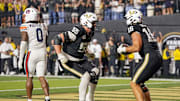 Vanderbilt tight end Cole Spence (16) celebrates his touchdown with offensive lineman Bryce Henderson (55) during overtime at FirstBank Stadium in Nashville, Tenn., Saturday, Nov. 8, 2025.