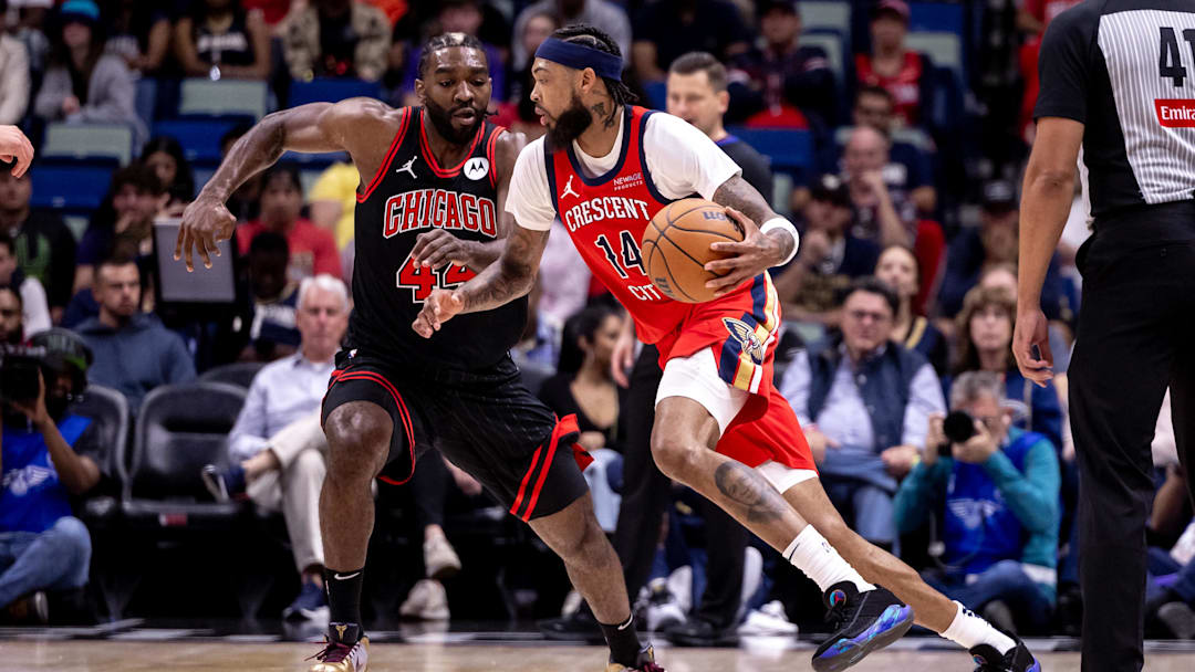 Oct 23, 2024; New Orleans, Louisiana, USA;  New Orleans Pelicans forward Brandon Ingram (14) dribbles against Chicago Bulls forward Patrick Williams (44) during the first half at Smoothie King Center.