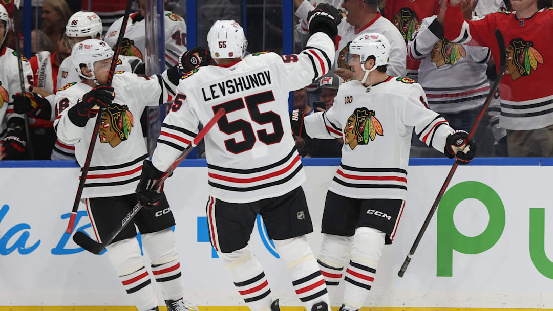 Oct 23, 2025; Tampa, Florida, USA; Chicago Blackhawks center Ryan Donato (8) is  congratulated  after he scored a goal against the Tampa Bay Lightning during the second period at Benchmark International Arena. Mandatory Credit: Kim Klement Neitzel-Imagn Images