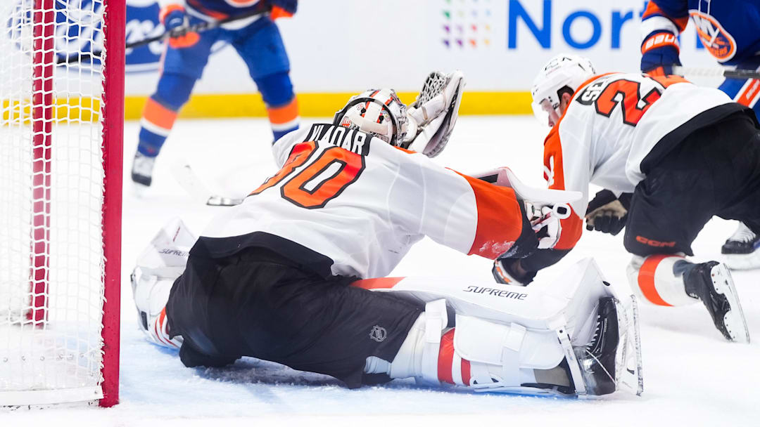 Apr 3, 2026; Elmont, New York, USA;  Philadelphia Flyers goaltender Dan Vladar (80) makes a save against the New York Islanders in the second period at UBS Arena.