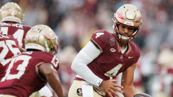 Aug 24, 2024; Dublin, IRL; Florida State University's DJ Uiagalelei looks to hand off the ball against Georgia Tech at Aviva Stadium. Mandatory Credit: Tom Maher/INPHO via USA TODAY Sports