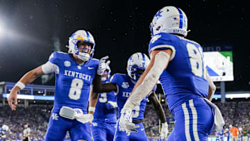 Kentucky Wildcats quarterback Cutter Boley (8), left, celebrates his touchdown pass to Kentucky Wildcats tight end Willie Rodriguez (81) in the second quarter as the Wildcats are rolling in the football game against Eastern Michigan at Kroger Field in Lexington, Kentucky Saturday, Sept. 13, 2025.