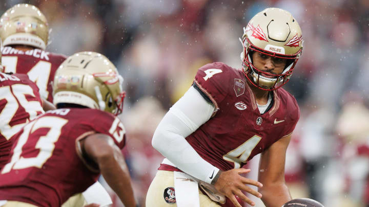 Aug 24, 2024; Dublin, IRL; Florida State University's DJ Uiagalelei looks to hand off the ball against Georgia Tech at Aviva Stadium. Mandatory Credit: Tom Maher/INPHO via USA TODAY Sports