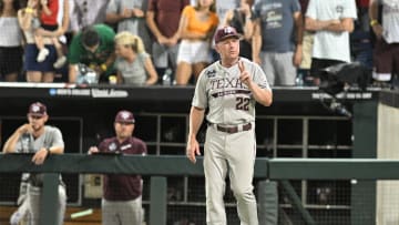 Jun 24, 2024; Omaha, NE, USA;  Texas A&M Aggies head coach Jim Schlossnagle signals the umpire against the Tennessee Volunteers during the ninth inning at Charles Schwab Field Omaha. Mandatory Credit: Steven Branscombe-USA TODAY Sports