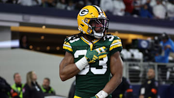Jan 14, 2024; Arlington, Texas, USA; Green Bay Packers running back Aaron Jones (33) reacts after scoring a touchdown against the Dallas Cowboys during the first quarter for the 2024 NFC wild card game at AT&T Stadium. Mandatory Credit: Kevin Jairaj-Imagn Images