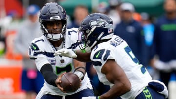 Seattle Seahawks quarterback Geno Smith (7) hands off to running back Kenneth Walker III (9) in the first quarter of the NFL Week 6 game between the Cincinnati Bengals and the Seattle Seahawks at Paycor Stadium in downtown Cincinnati on Sunday, Oct. 15, 2023.