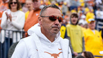 Texas head coach Steve Sarkisian takes the field for warm up at Michigan Stadium in Ann Arbor on Saturday, Sept. 7, 2024.