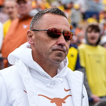 Texas head coach Steve Sarkisian takes the field for warm up at Michigan Stadium in Ann Arbor on Saturday, Sept. 7, 2024.