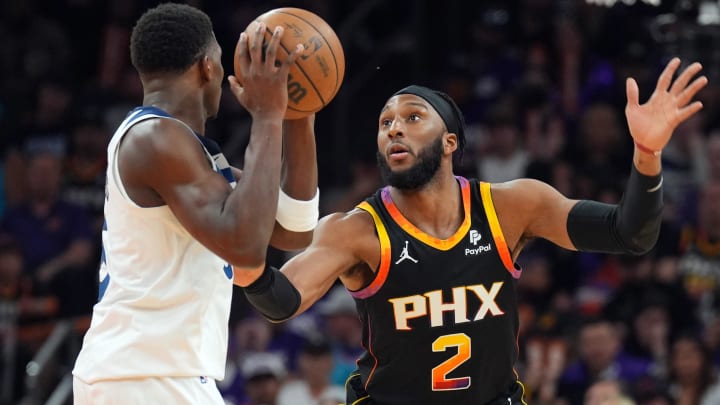Apr 28, 2024; Phoenix, Arizona, USA; Phoenix Suns forward Josh Okogie (2) guards Minnesota Timberwolves guard Anthony Edwards (5) during the second half of game four of the first round for the 2024 NBA playoffs at Footprint Center. Mandatory Credit: Joe Camporeale-USA TODAY Sports
