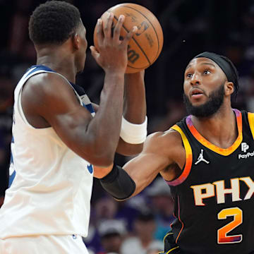 Apr 28, 2024; Phoenix, Arizona, USA; Phoenix Suns forward Josh Okogie (2) guards Minnesota Timberwolves guard Anthony Edwards (5) during the second half of game four of the first round for the 2024 NBA playoffs at Footprint Center. Mandatory Credit: Joe Camporeale-Imagn Images