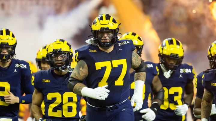 Jan 8, 2024; Houston, TX, USA; Michigan Wolverines offensive lineman Trevor Keegan (77) against the Washington Huskies during the 2024 College Football Playoff national championship game at NRG Stadium. Mandatory Credit: Mark J. Rebilas-USA TODAY Sports