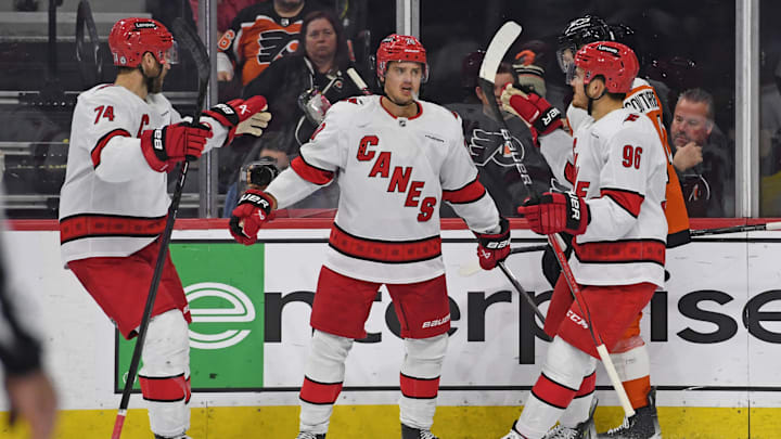 Nov 20, 2024; Philadelphia, Pennsylvania, USA; Carolina Hurricanes center Sebastian Aho (20) celebrates his goal with defenseman Jaccob Slavin (74) and center Jack Roslovic (96) against the Philadelphia Flyers during the third period at Wells Fargo Center. Mandatory Credit: Eric Hartline-Imagn Images