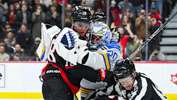Dec 6, 2025; Ottawa, Ontario, CAN; St. Louis Blues goalie Joel Hofer (30) fights against Ottawa Senators center Tim Stutzle (18) during the third period at Canadian Tire Centre. Mandatory Credit: David Kirouac-Imagn Images