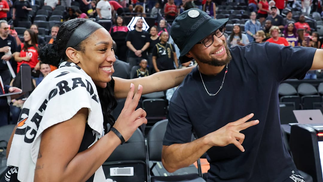 LAS VEGAS, NEVADA – SEPTEMBER 10: A’ja Wilson #22 of the Las Vegas Aces poses with NBA player Stephen Curry after the Aces’ 100-85 victory over the Phoenix Mercury at T-Mobile Arena on September 10, 2023 in Las Vegas, Nevada. NOTE TO USER: User expressly acknowledges and agrees that, by downloading and or using this photograph, User is consenting to the terms and conditions of the Getty Images License Agreement. (Photo by Ethan Miller/Getty Images)