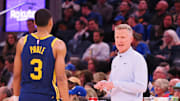 Dec 2, 2022; San Francisco, California, USA; Golden State Warriors head coach Steve Kerr speaks with shooting guard Jordan Poole (3) between plays against the Chicago Bulls during the fourth quarter at Chase Center. Mandatory Credit: Kelley L Cox-Imagn Images