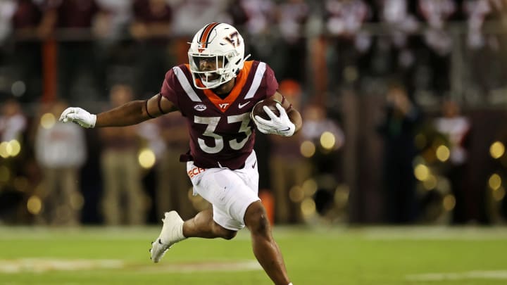 Sep 30, 2023; Blacksburg, Virginia, USA; Virginia Tech Hokies running back Bhayshul Tuten (33) runs the ball during the first quarter against the Pittsburgh Panthers at Lane Stadium. Mandatory Credit: Peter Casey-USA TODAY Sports