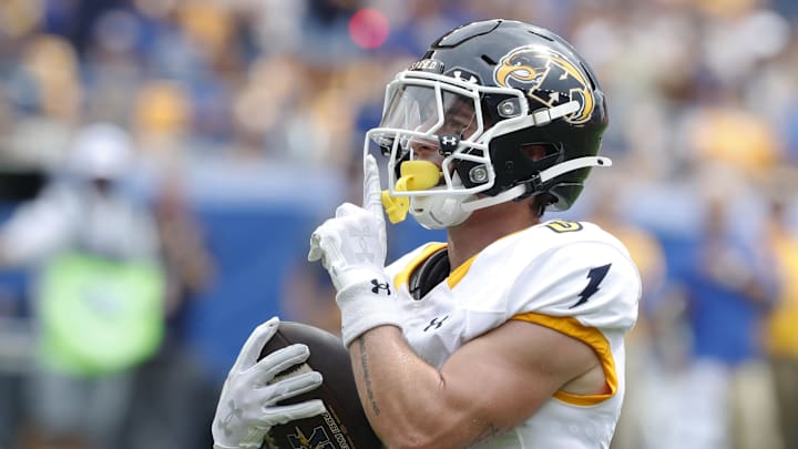 Aug 31, 2024; Pittsburgh, Pennsylvania, USA;  Kent State Golden Flashes wide receiver Luke Floriea (0) gestures to the Pittsburgh Panthers student section after scoring a touchdown during the first quarter at Acrisure Stadium. Mandatory Credit: Charles LeClaire-Imagn Images