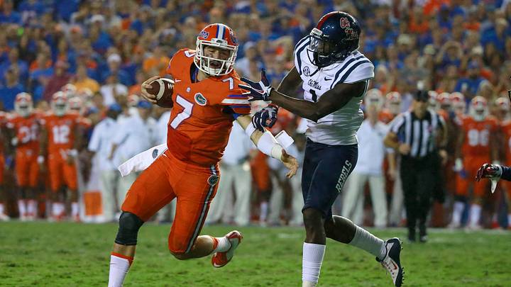 Oct 3, 2015; Gainesville, FL, USA; Florida Gators quarterback Will Grier (7) runs with the ball as Mississippi Rebels defensive back Tony Bridges (1) defends during the second half at Ben Hill Griffin Stadium. Florida Gators defeated the Mississippi Rebels 38-10. Mandatory Credit: Kim Klement-USA TODAY Sports
