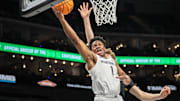 Mar 12, 2025; Kansas City, MO, USA; West Virginia Mountaineers guard Joseph Yesufu (1) shoots the ball during the first half against the Colorado Buffaloes at T-Mobile Center. Mandatory Credit: William Purnell-Imagn Images