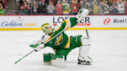 Nov 19, 2025; Saint Paul, Minnesota, USA; Minnesota Wild goaltender Jesper Wallstedt (30) celebrates after making the game winning save against Carolina Hurricanes left wing Taylor Hall (71) in the overtime shootout at Grand Casino Arena. Mandatory Credit: Matt Blewett-Imagn Images