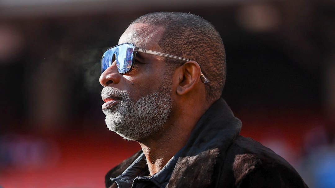 Dec 21, 2025; Cleveland, Ohio, USA;  Legendary  football and baseball player and father of Cleveland Browns quarterback Shedeur Sanders, Deion Sanders on the sidelines prior to a game against the Buffalo Bills at Huntington Bank Field. Credit: Scott Galvin-Imagn Images