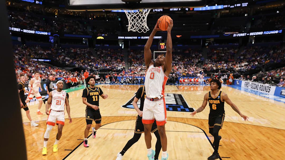 Mar 20, 2026; Tampa, FL, USA; Clemson Tigers forward RJ Godfrey (0) dunks the ball in the first half against the Iowa Hawkeyes during a first round game of the men's 2026 NCAA Tournament at Benchmark International Arena. Mandatory Credit: Nathan Ray Seebeck-Imagn Images