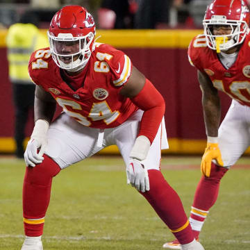 Dec 31, 2023; Kansas City, Missouri, USA; Kansas City Chiefs offensive tackle Wanya Morris (64) and running back Isiah Pacheco (10) at the line of scrimmage against the Cincinnati Bengals during the game at GEHA Field at Arrowhead Stadium. Mandatory Credit: Denny Medley-USA TODAY Sports
