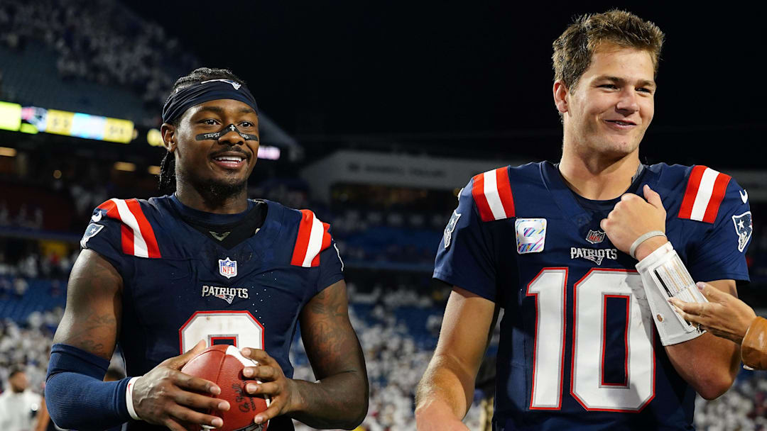 New England Patriots quarterback Drake Maye (10) and wide receiver Stefon Diggs (8) walk off the field against the Buffalo Bills after the game at Highmark Stadium.