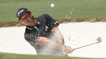 Patrick Reed plays a shot from a bunker during the final round of The Masters