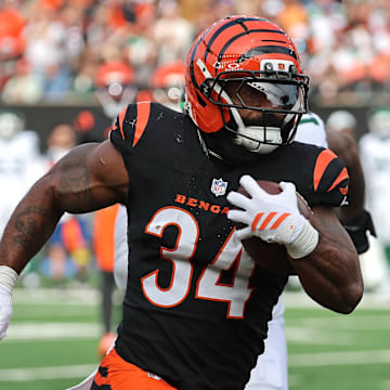 Oct 26, 2025; Cincinnati, Ohio, USA; Cincinnati Bengals running back Samaje Perine (34) runs with the ball during the third quarter against the New York Jets at Paycor Stadium. Mandatory Credit: Joseph Maiorana-Imagn Images