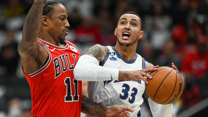 Oct 21, 2022; Washington, District of Columbia, USA; Washington Wizards forward Kyle Kuzma (33) makes a move to the basket as Chicago Bulls forward DeMar DeRozan (11) defends  at Capital One Arena. Mandatory Credit: Tommy Gilligan-USA TODAY Sports