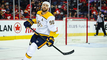 Jan 4, 2025; Calgary, Alberta, CAN; Nashville Predators center Ryan O'Reilly (90) scores a goal against the Calgary Flames during the third period at Scotiabank Saddledome. Mandatory Credit: Sergei Belski-Imagn Images