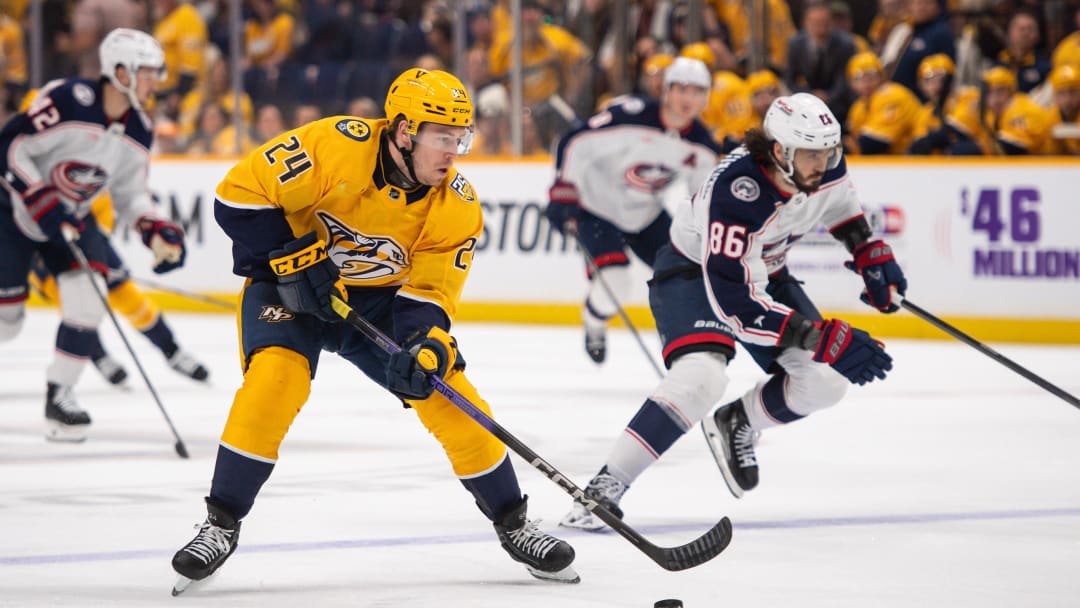 Apr 13, 2024; Nashville, Tennessee, USA; Nashville Predators defenseman Spencer Stastney (24) skates against the Columbus Blue Jackets during the first period at Bridgestone Arena. Mandatory Credit: Steve Roberts-USA TODAY Sports