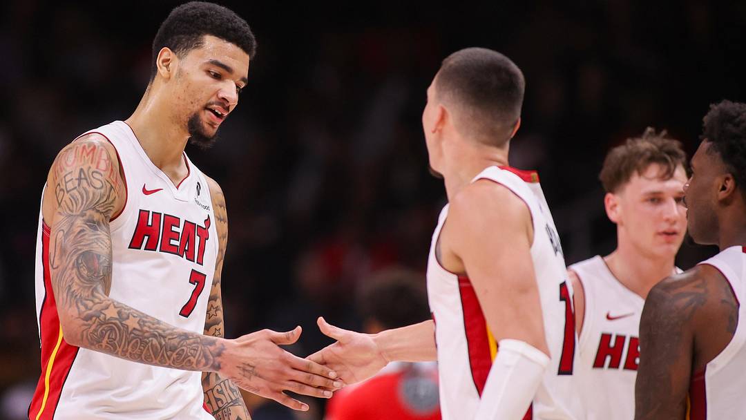Feb 20, 2026; Atlanta, Georgia, USA; Miami Heat center Kel'el Ware (7) celebrates with guard Tyler Herro (14) after a basket against the Atlanta Hawks in the fourth quarter at State Farm Arena. Mandatory Credit: Brett Davis-Imagn Images
