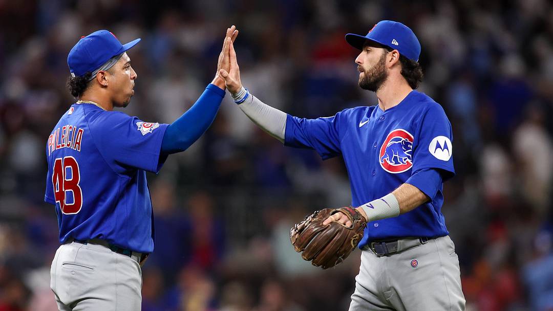 May 14, 2026; Atlanta, Georgia, USA; Chicago Cubs pitcher Daniel Palencia (48) and shortstop Dansby Swanson (7) celebrate after a victory over the Atlanta Braves at Truist Park. Mandatory Credit: Brett Davis-Imagn Images