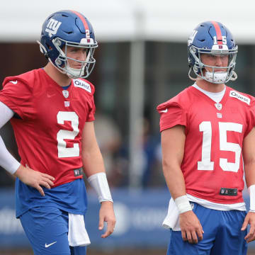 Jul 24, 2024; East Rutherford, NJ, USA; New York Giants quarterback Drew Lock (2) and quarterback Tommy DeVito (15) look on during training camp at Quest Diagnostics Training Facility.  