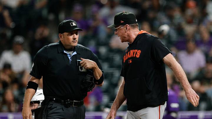 Sep 3, 2025; Denver, Colorado, USA; San Francisco Giants manager Bob Melvin (6) talks with home plate umpire Dan Bellino (2) in the fifth inning against the Colorado Rockies at Coors Field. Mandatory Credit: Isaiah J. Downing-Imagn Images
