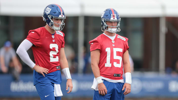 Jul 24, 2024; East Rutherford, NJ, USA; New York Giants quarterback Drew Lock (2) and quarterback Tommy DeVito (15) look on during training camp at Quest Diagnostics Training Facility.  