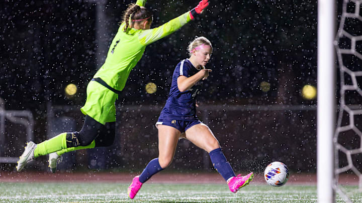 Marist's Libby McLaughlin shoots the ball past La Grande's Lyndie Isaacson.