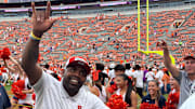 September 20, 2025; Clemson, South Carolina, USA; A jubilant Syracuse coach Fran Brown waves to the Orange supporters inside Memorial Stadium following Syracuse's 34-21 upset victory over the host Tigers.  Syracuse improved to 3-1 and 1-0 in the ACC with the victory.  Mandatory Credit: Brad Bierman, The Juice Online-On SI 