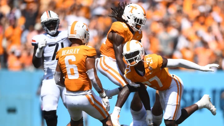 Virginia Cavaliers quarterback Tony Muskett (11) lays on the ground as Volunteers defensive lineman James Pearce Jr. (27) celebrates his sack with teammates during their game at Nissan Stadium Saturday, Sept. 2, 2023.